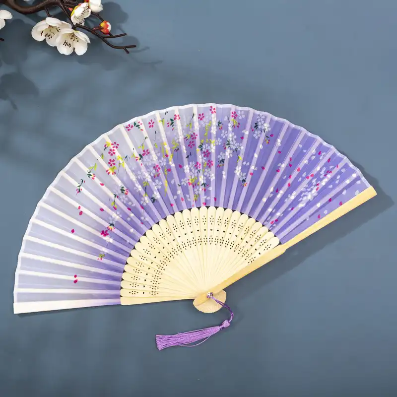 Gift presentation packaging of silk bamboo folding fan for special occasions.