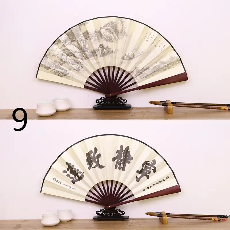 Fan opening sequence showing smooth bamboo joint mechanism and gradual silk surface expansion.