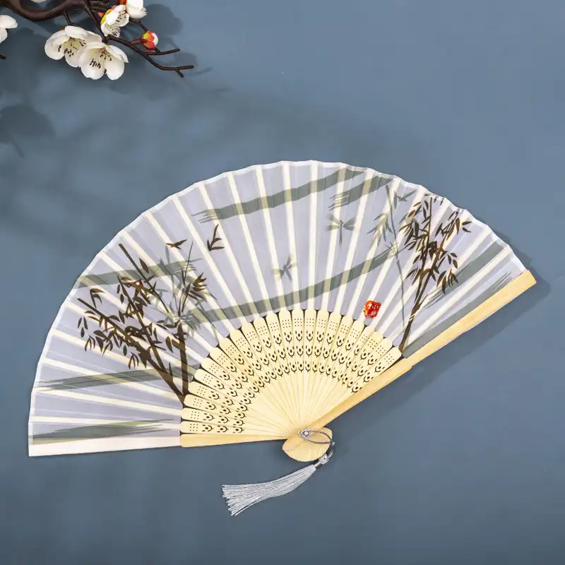 Multiple colored silk fans arranged showing variety of available printed pattern options.
