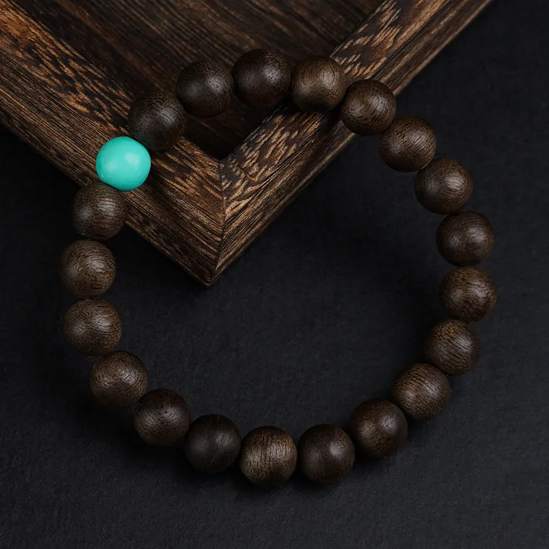 Handcrafted prayer beads bracelet demonstrating traditional Buddhist jewelry craftsmanship.