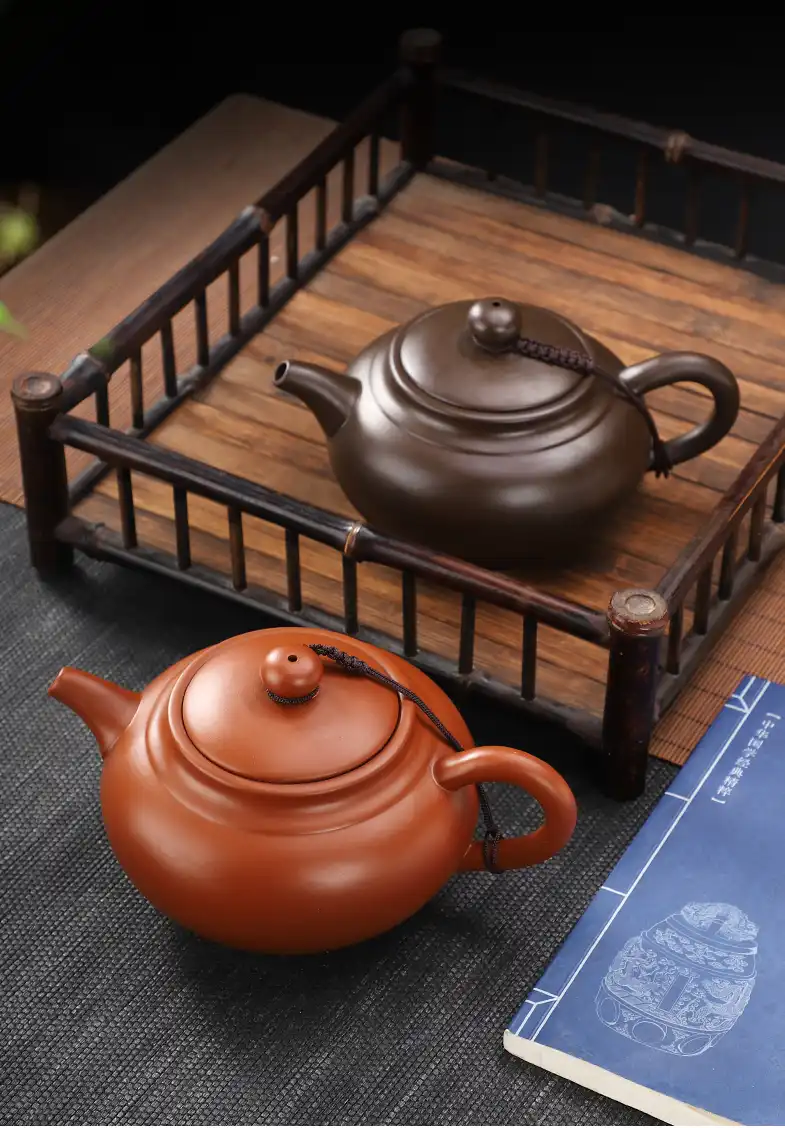 Custom filter system inside Yixing beauty teapot showing fine mesh for perfect tea leaf straining.