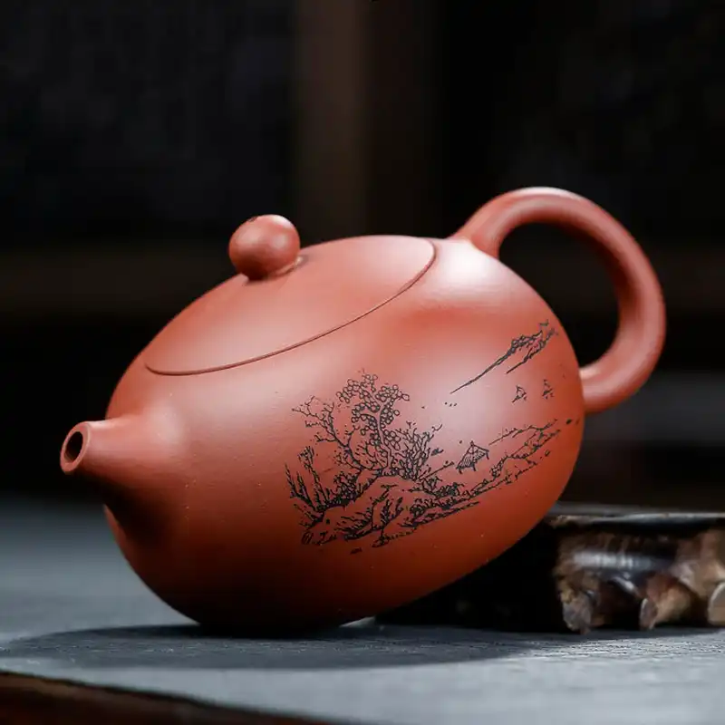 Purple clay teapot detail shot showing natural clay grain patterns and handcrafted quality.