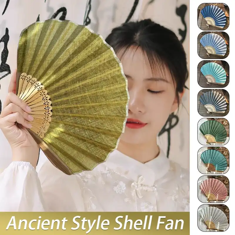 Japanese shell fan displayed as decorative piece showing versatile home decor styling potential.