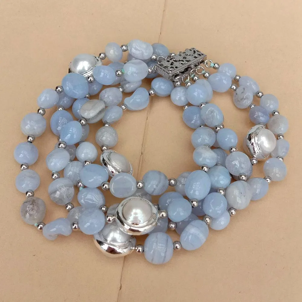 13mm cultured white potato pearls with white gold plated edges on strand bracelet.