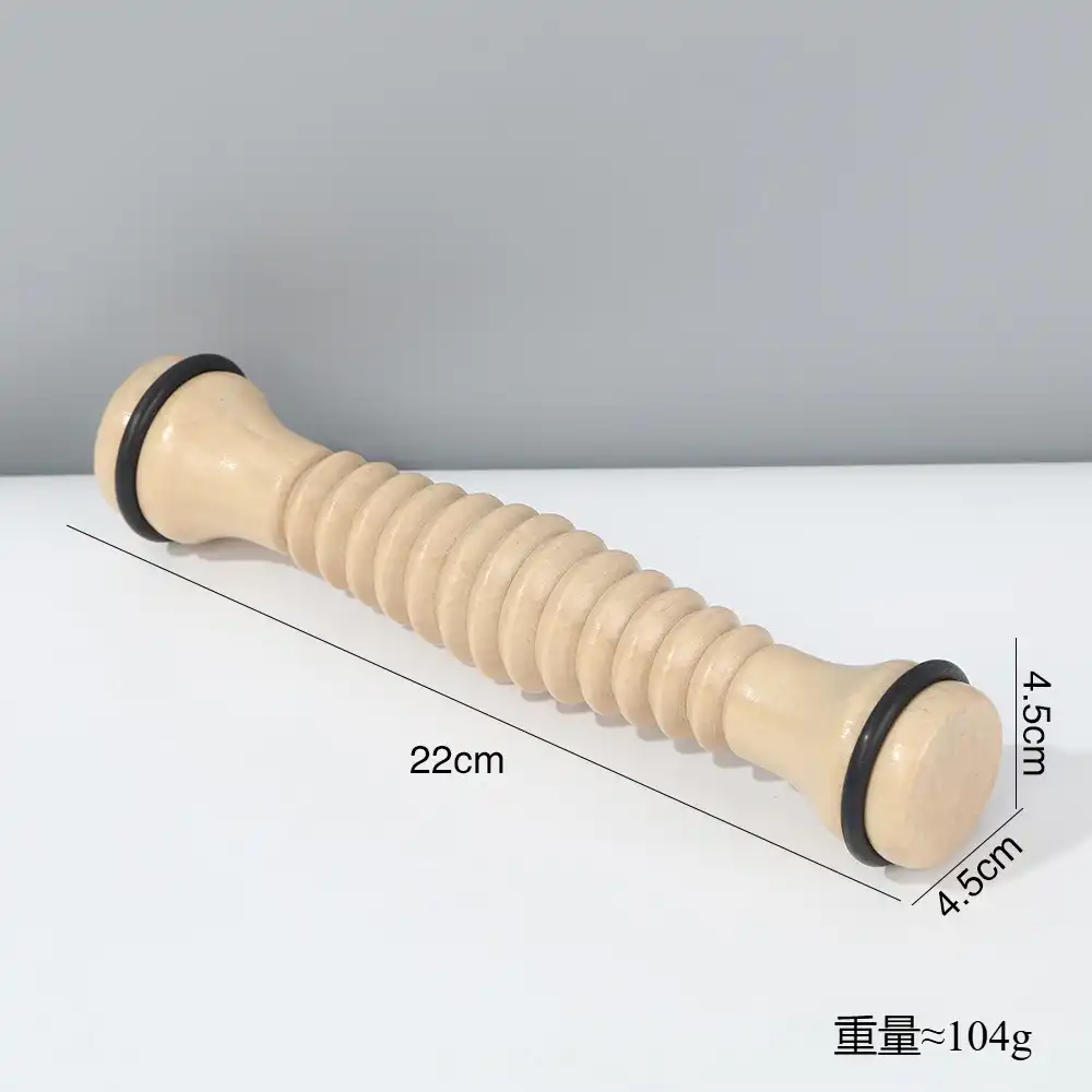 Portable wooden foot massager on white background, side angle..
