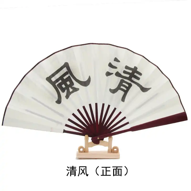 Size comparison of folded fan next to common objects demonstrating portable 10 inch compact dimensions.