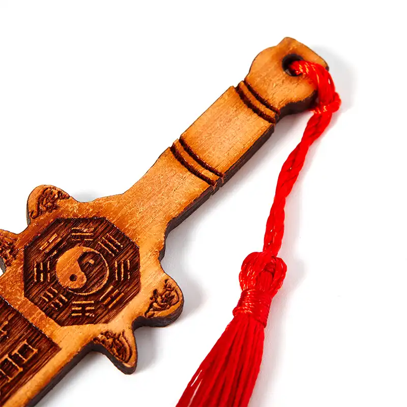 Handcarved Tai Chi Eight Diagrams Peach Wood Sword feng shui protection tool with traditional design.