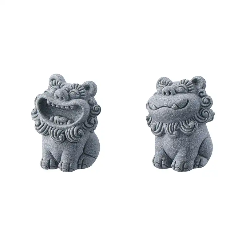 Close up detail of intricate carving on traditional foo dog statue showing facial features and craftsmanship.