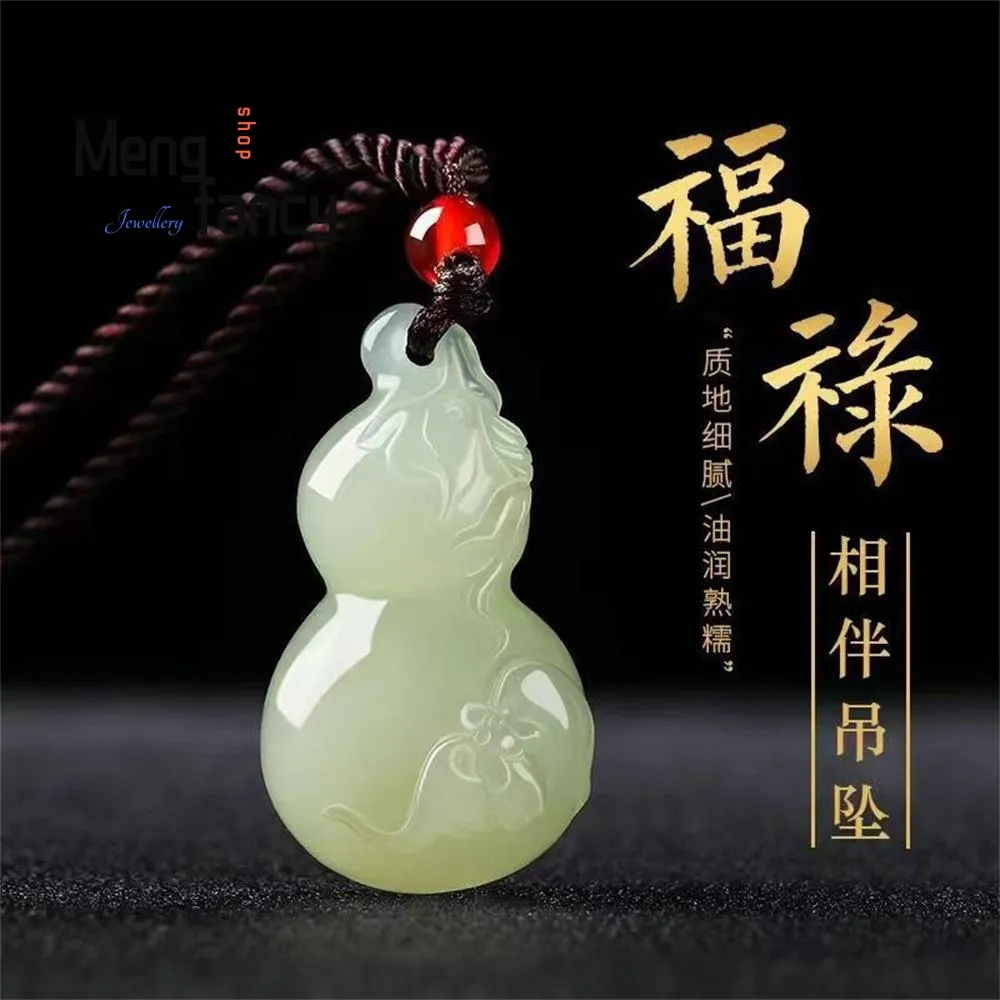 Natural Hetian jade gourd pendant showing green white color variations and traditional Chinese craftsmanship.