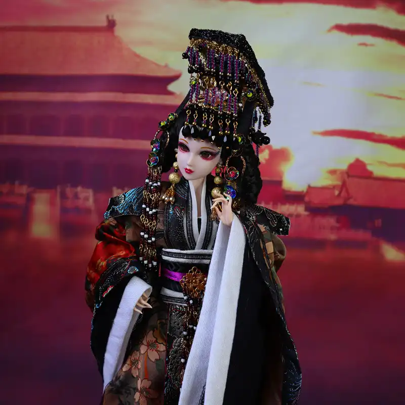 Close up of handmade doll face displaying traditional Chinese empress makeup and styling.