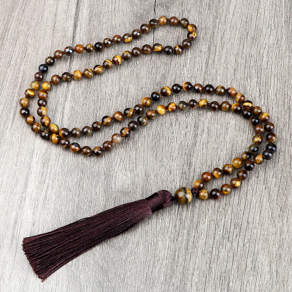 Braided rope chain construction detail of Buddhist meditation mala necklace.