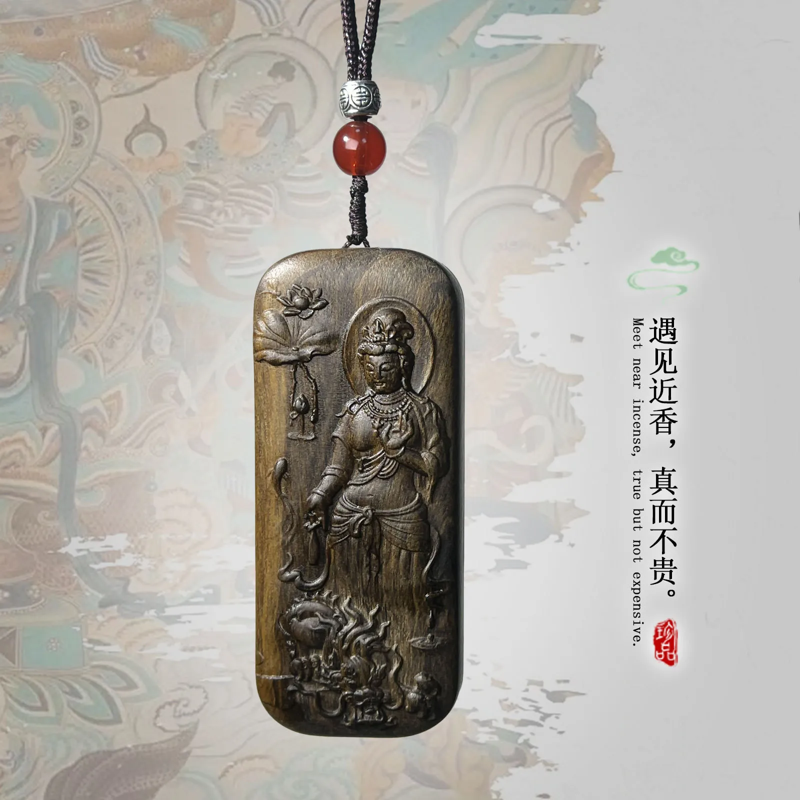 Agarwood Guanyin pendant hanging in car as protective travel ornament and spiritual blessing.