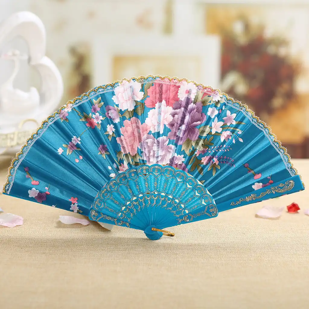 Side profile of folded Japanese fan showing compact portable design and gold rib accents.