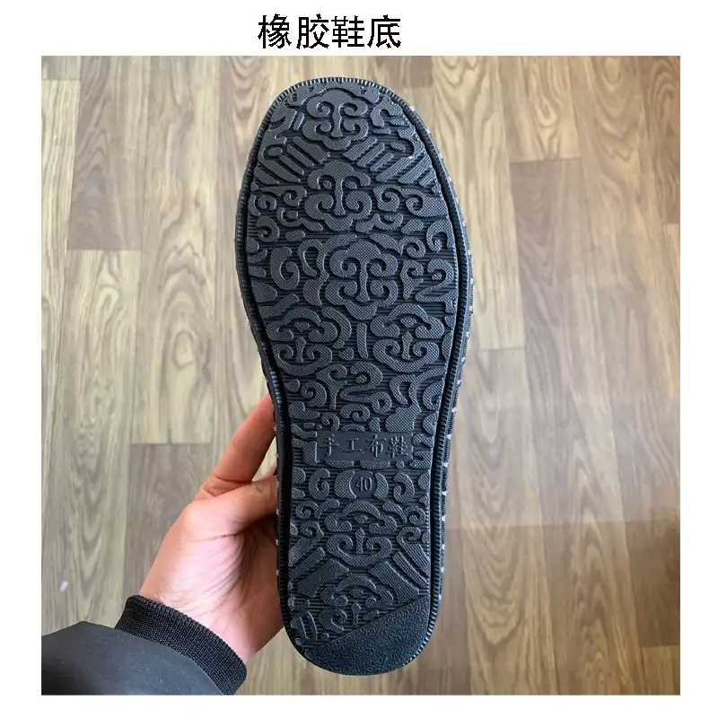 Embroidered ethnic shoes worn with Hanfu outfit demonstrating traditional Chinese cultural styling.