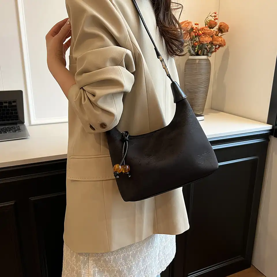 Luxury handbag flat lay displaying dimensions and overall aesthetic appeal.