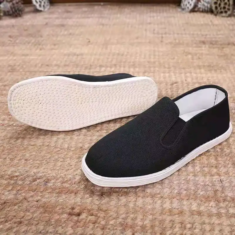 Close-up of kung fu shoe sole displaying anti-slip rubber outsole pattern for stability.