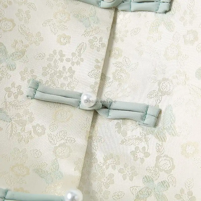 Tang suit shirt fabric detail showing polyester broadcloth texture and elegant drape.