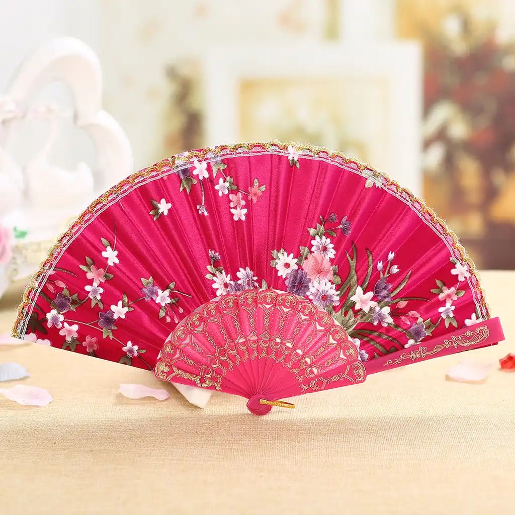 Packaging display of Japanese silk folding fan showing careful presentation for gift giving.
