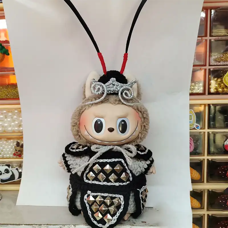 Close-up view of handmade craftsmanship details and premium metal construction quality on designer figure.