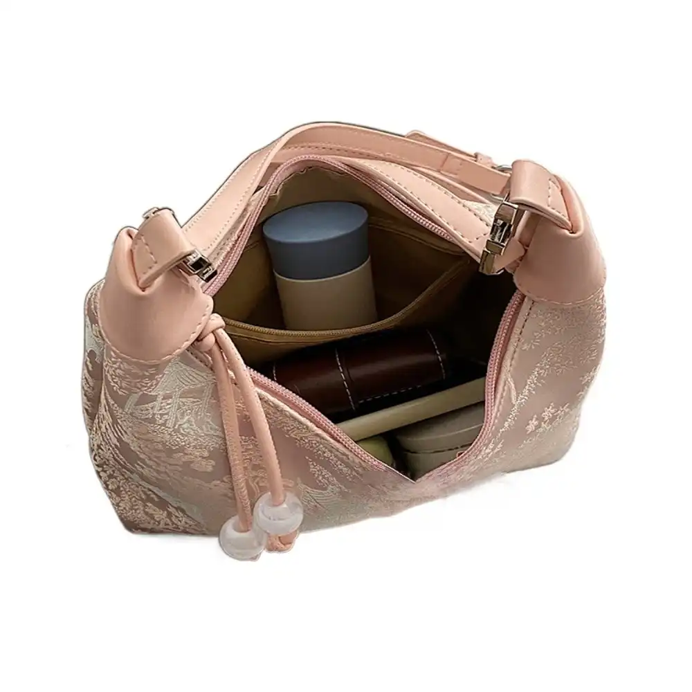 Interior view of tote bag showing spacious polyester lining and organizational pockets.
