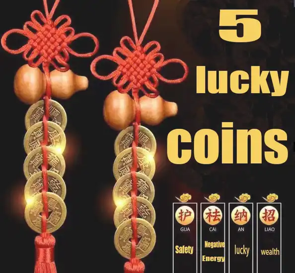 Close-up view of five emperor coins with Chinese characters and gourd pendant textile construction.
