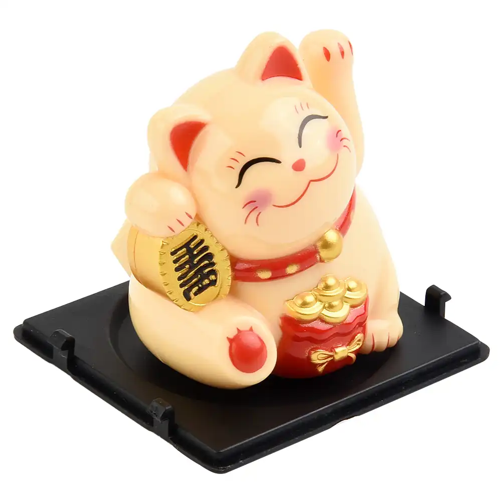 Dashboard safety consideration showing non-obstructive placement of lucky cat ornament.