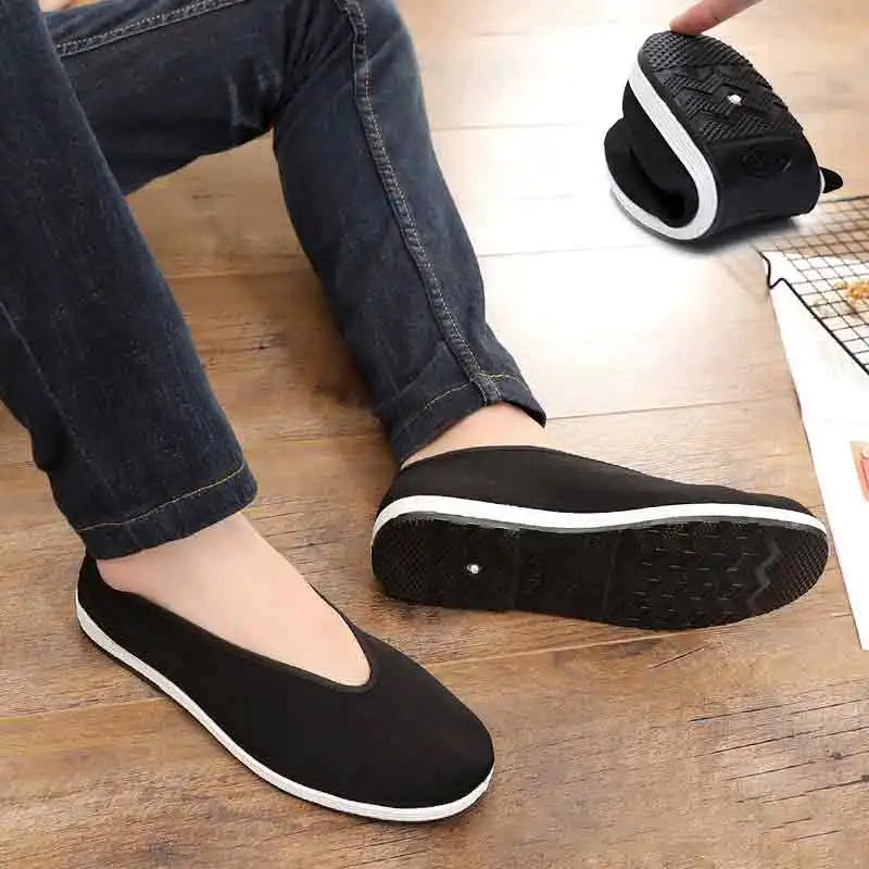 Black cloth kung fu shoes with textile insole visible showing comfort construction features.