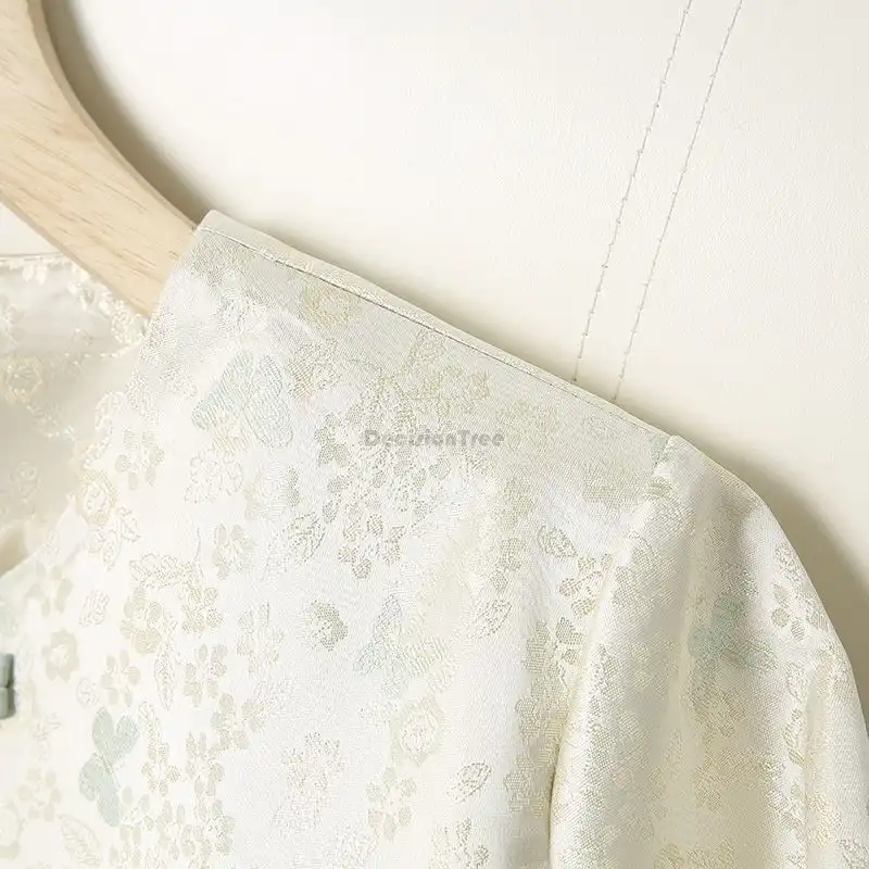 Close-up detail of lapel collar construction and premium satin finish on tang suit shirt.