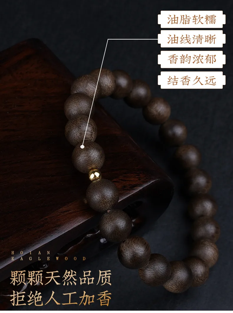 Premium quality Kyara agarwood bracelet with natural oil content visible in wood grain.