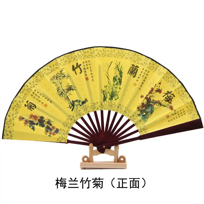 Multiple angle view of bamboo fan showing side profile and thickness when folded for travel storage.