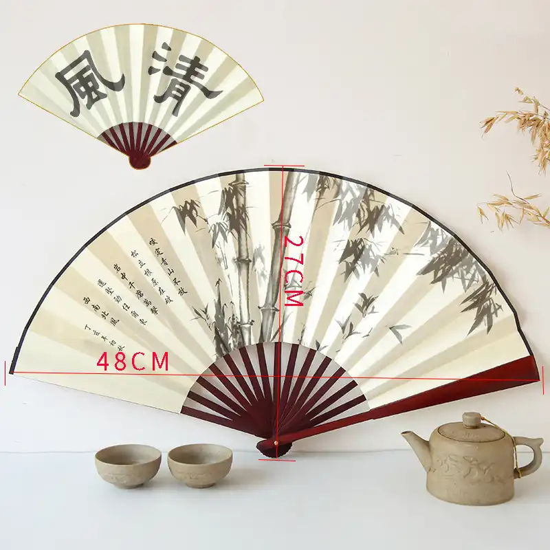 Back side of folding fan showing complementary traditional Chinese motifs and elegant color schemes.