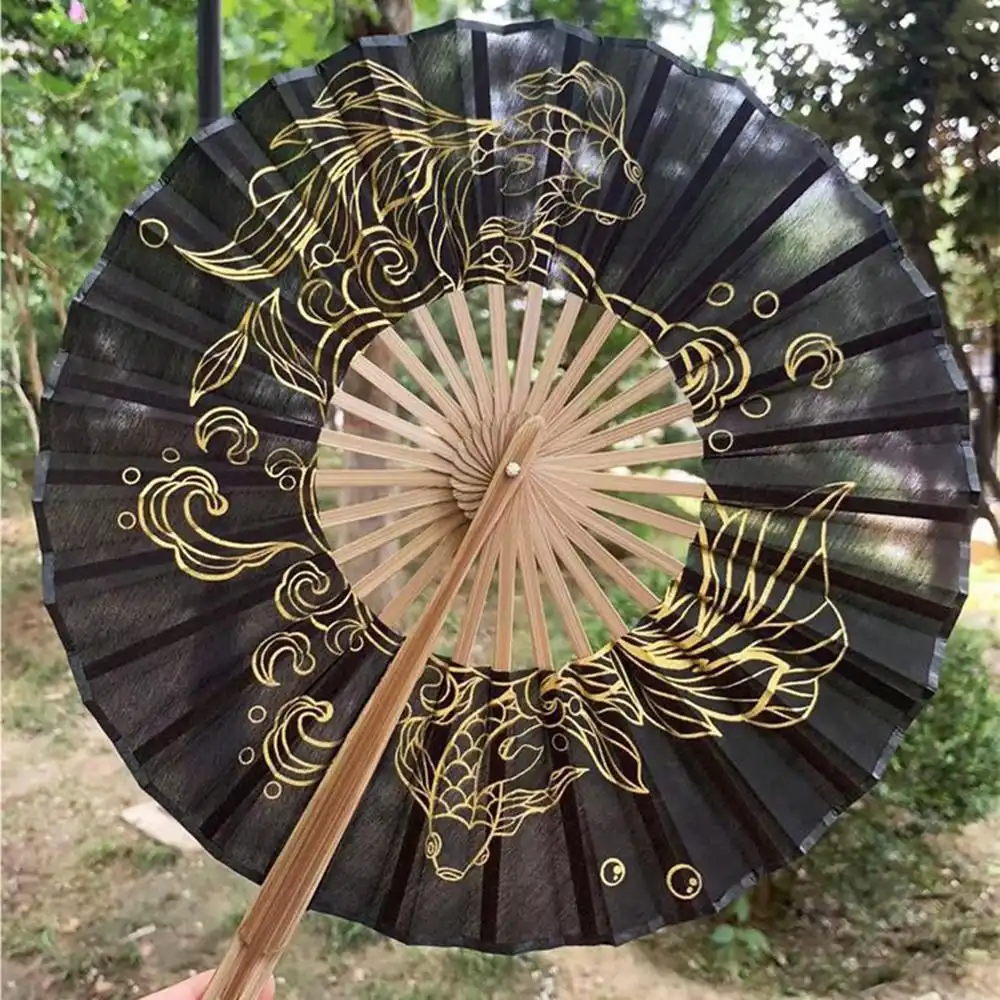 Black round hand fan demonstrating sophisticated color option and handmade bamboo frame.