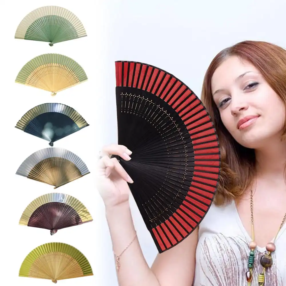 Folk dance performance showcasing color changing fan as dramatic stage prop.