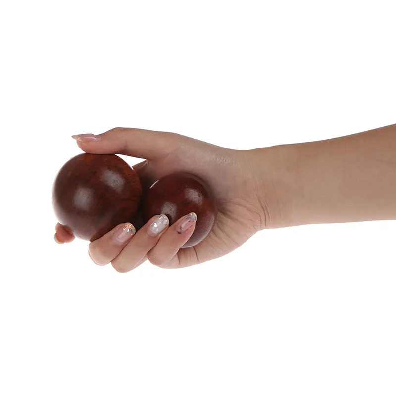 Natural agate Chinese Baoding meditation balls pair showing smooth polished surface and 5cm diameter.