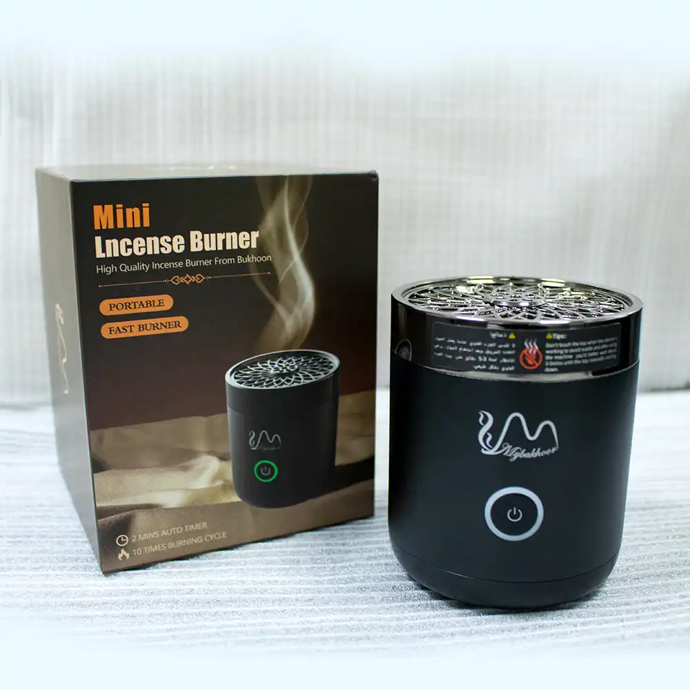 Compact mini USB rechargeable electric incense burner with LED indicator and power button.