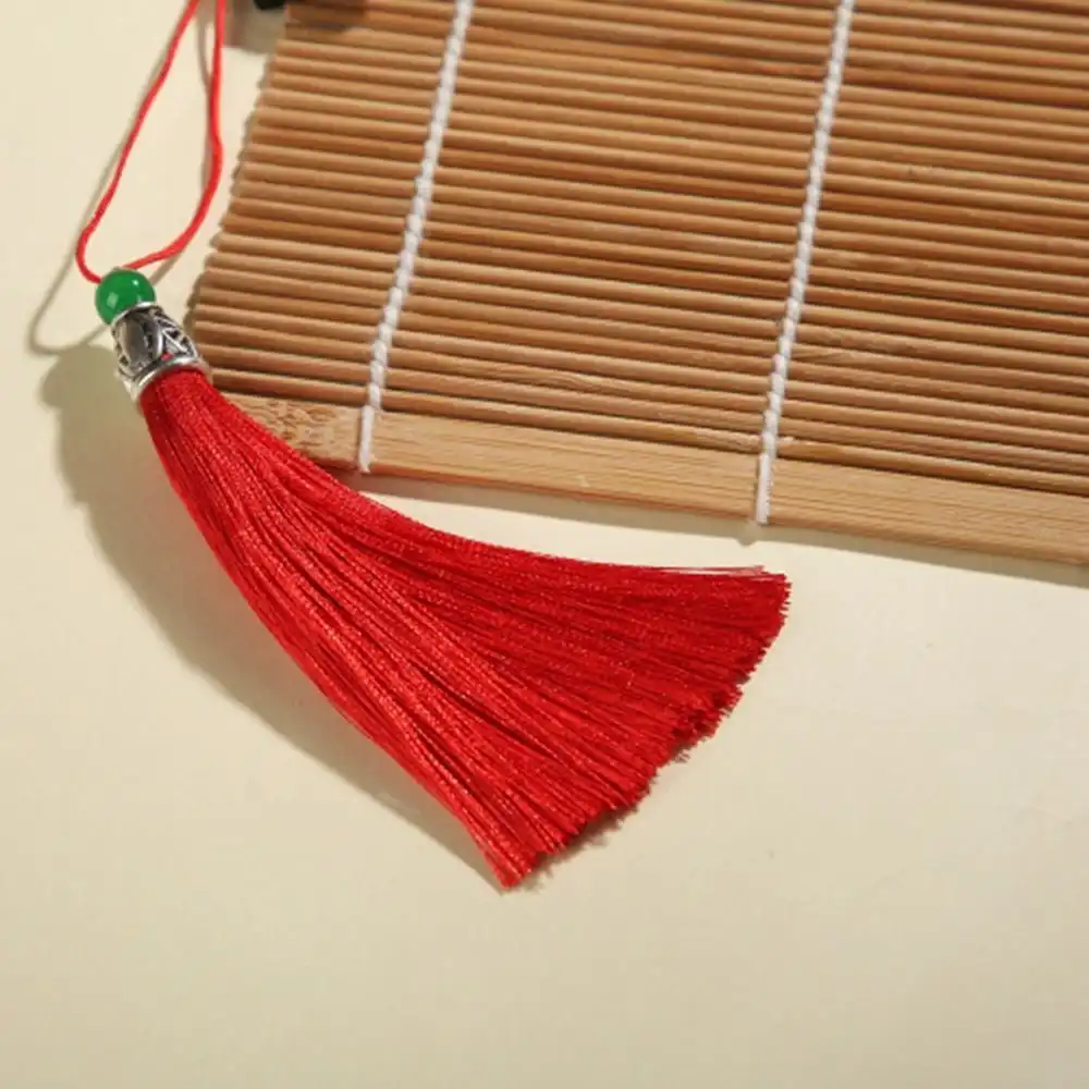 Kimono performer using classical bamboo fan as traditional dance prop accessory.