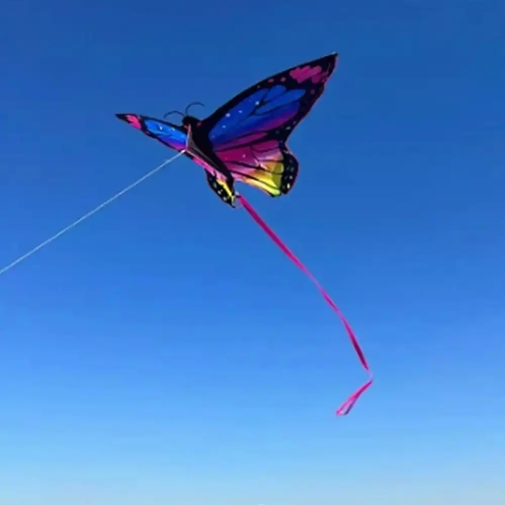 Realistic multicolor butterfly kite showing detailed wing design and impressive wingspan.