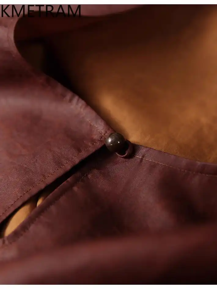 Close-up of O-neck collar detail highlighting quality finishing and elegant neckline design.