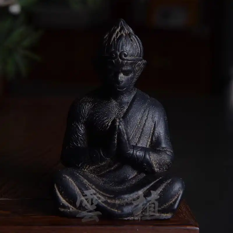 Side profile of carved stone Wukong statue highlighting three-dimensional craftsmanship and sculptural quality.