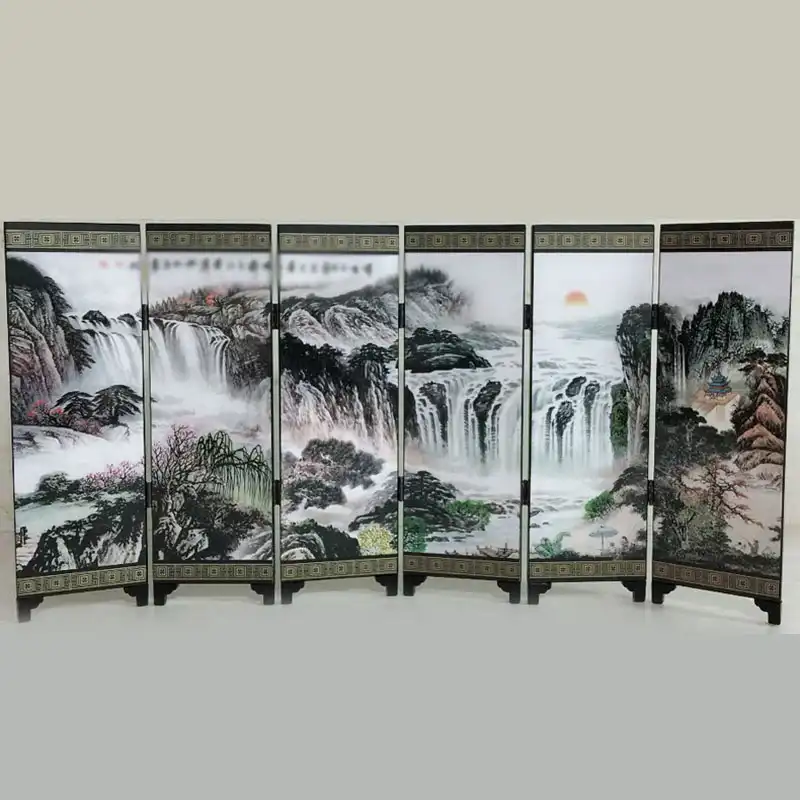 Close-up detail of wood grain texture and traditional Chinese scenic artwork on screen panels.