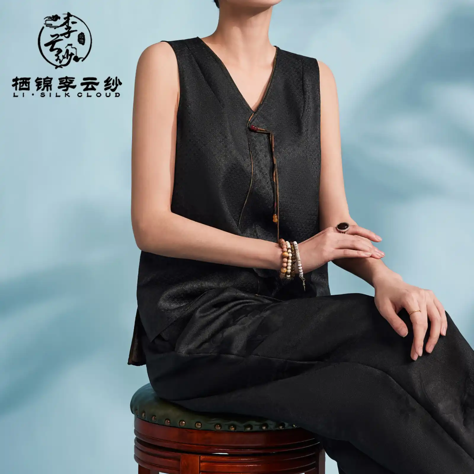 Model demonstrating drape and movement of premium mulberry silk sleeveless vest.