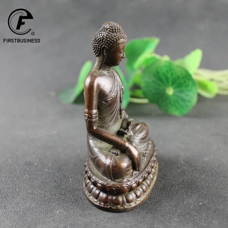 Meditation corner with Buddha incense burner creating zen atmosphere for spiritual practice.