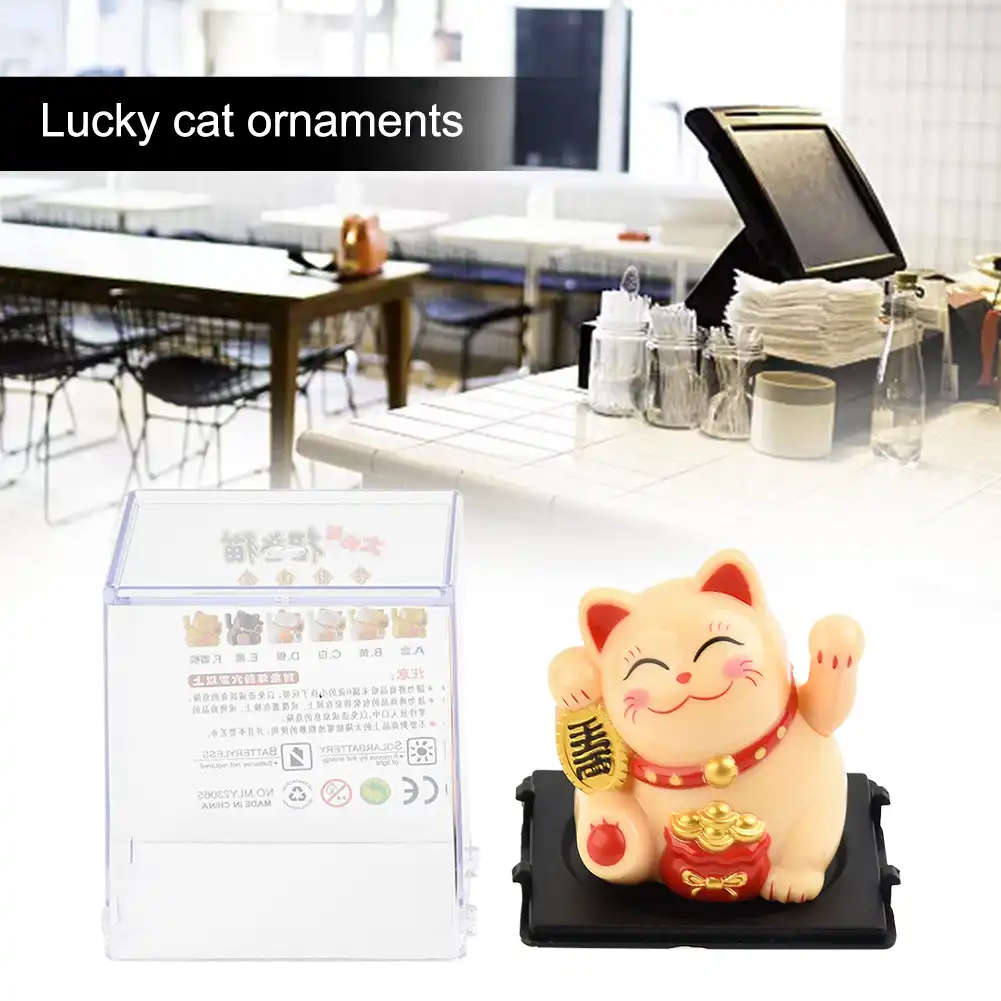 Solar powered cat ornament compatible with various car dashboard surfaces.