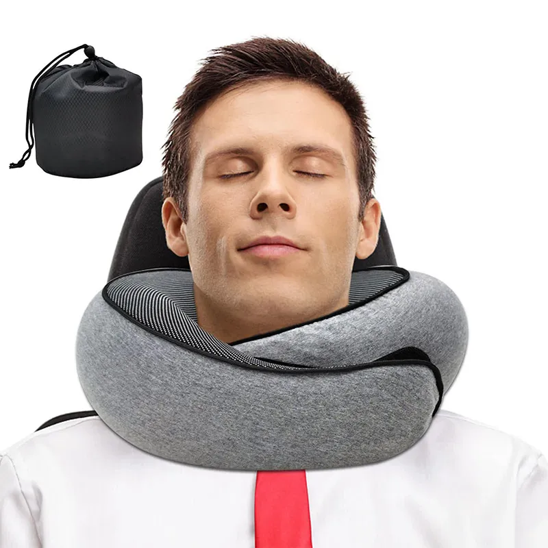 Pillow portability demonstration showing compact size next to luggage and travel bag.