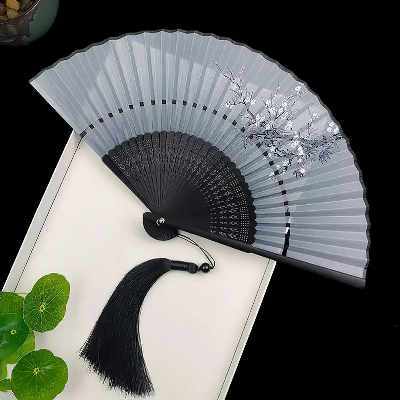 Theatrical production featuring Japanese fan as period costume and character accessory.