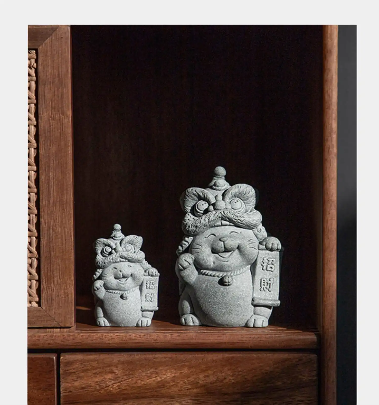 Feng shui arrangement with stone cat tea pet positioned for positive energy flow.