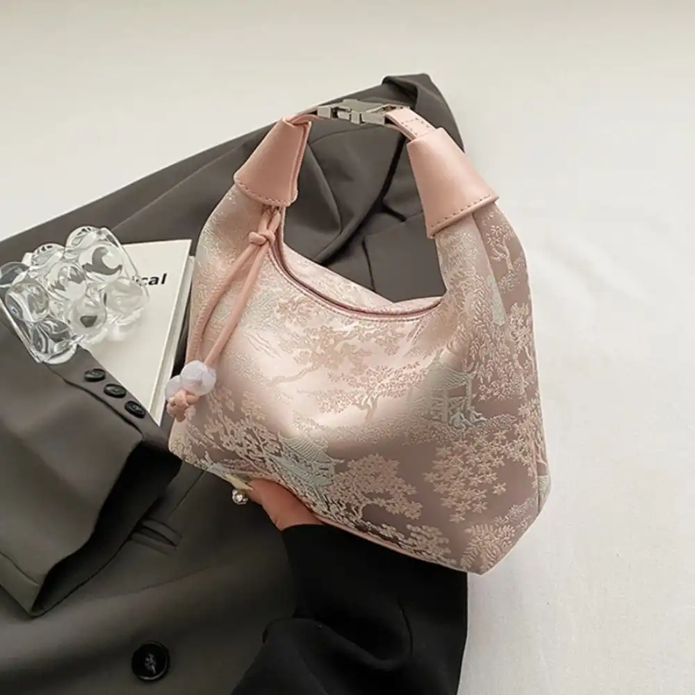 Adjustable strap detail showing versatile carrying options for different body types.