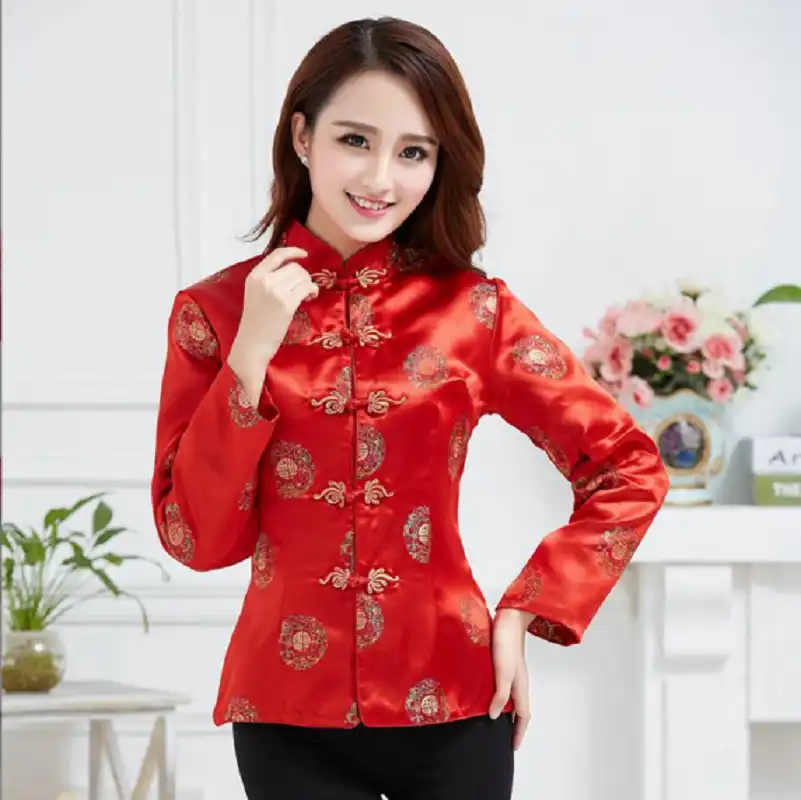 Back view of red tang suit jacket showing classic Chinese tailoring and elegant silhouette.