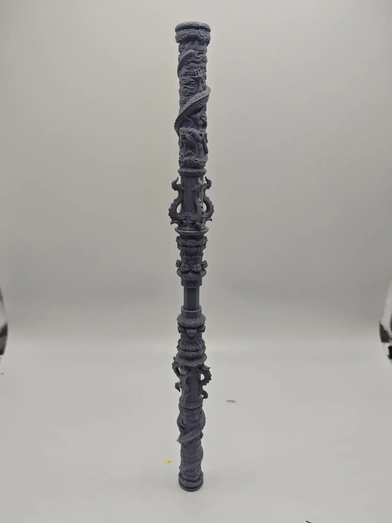 Size comparison of 100cm golden cudgel with everyday objects demonstrating impressive scale and presence.