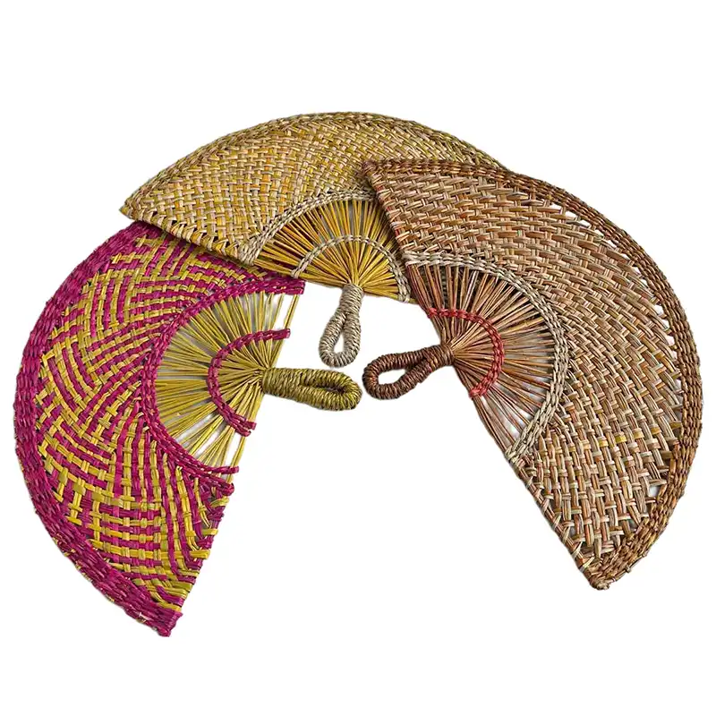 Professional photography using handwoven straw fan as creative prop in portrait session.